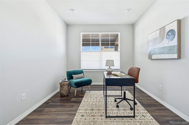 office with dark wood-style floors and baseboards