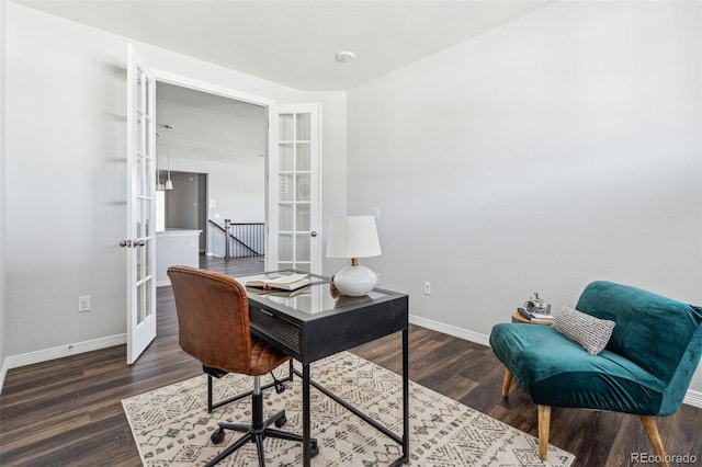 office area with wood finished floors, french doors, and baseboards