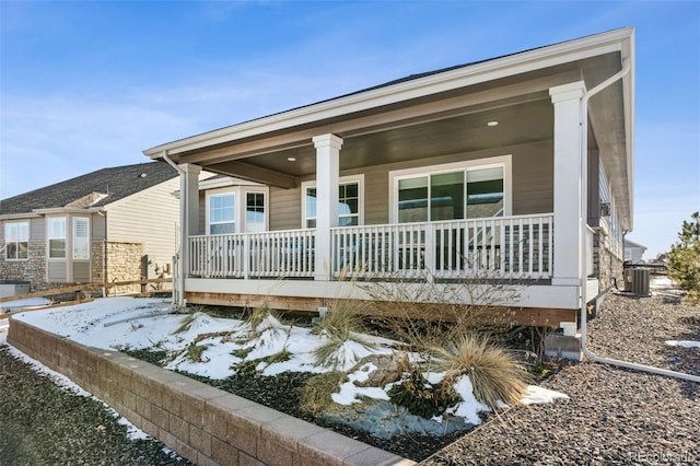 exterior space with a porch and central AC