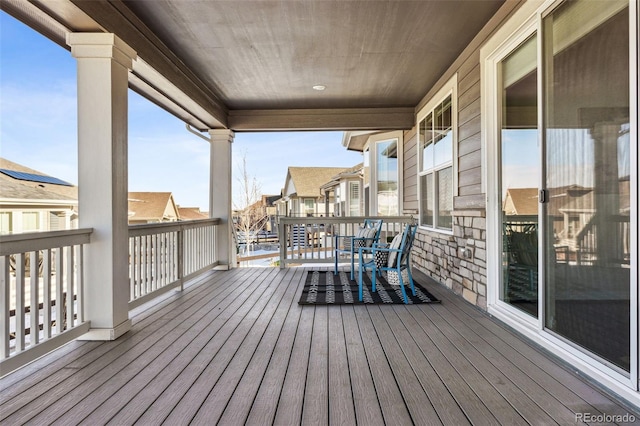 wooden deck with a residential view