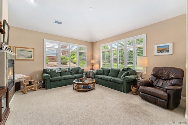 8595 Gold Peak Dr Unit A, Highlands Ranch, CO 80130 - carpeted living area featuring a glass covered fireplace