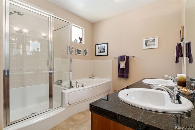 8595 Gold Peak Dr Unit A, Highlands Ranch, CO 80130 - full bathroom featuring a shower stall, a bath, double vanity, and tile patterned floors