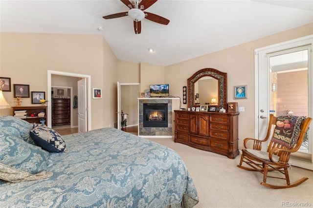 8595 Gold Peak Dr Unit A, Highlands Ranch, CO 80130 - bedroom featuring lofted ceiling, a tiled fireplace, carpet floors, and a ceiling fan