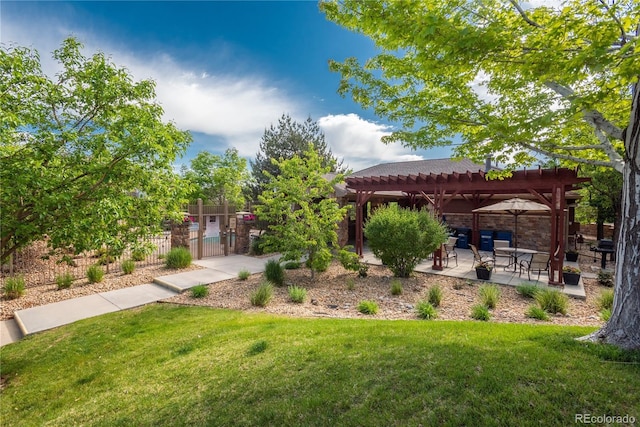 8595 Gold Peak Dr Unit A, Highlands Ranch, CO 80130 - view of yard featuring a pergola, a gate, and a patio area