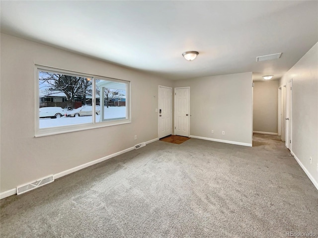 spare room featuring carpet