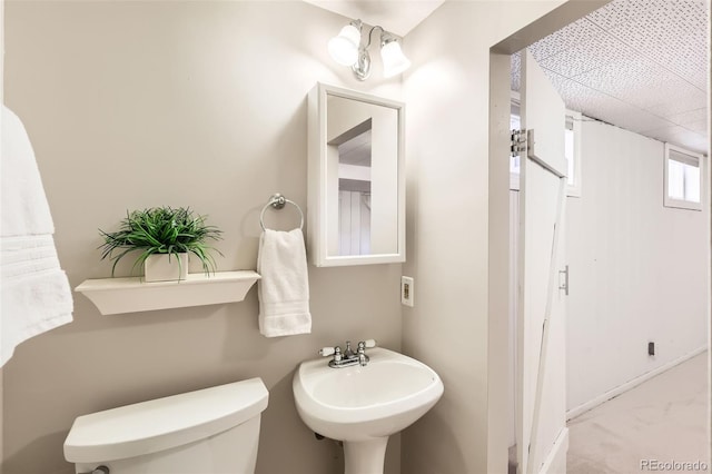 bathroom featuring toilet and a sink