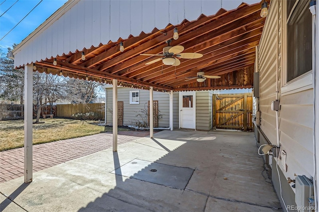 view of patio / terrace with a gate, fence, and ceiling fan