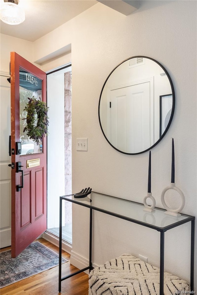 entrance foyer with hardwood / wood-style floors