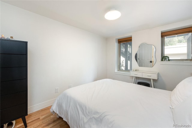 bedroom with light hardwood / wood-style flooring