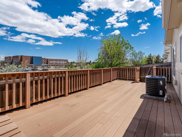 12335 E 2nd Dr, Aurora, CO 80011 - wooden deck featuring central AC
