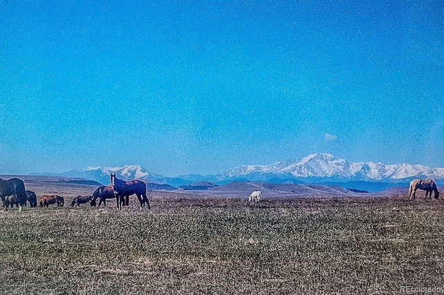 property view of mountains featuring a rural view