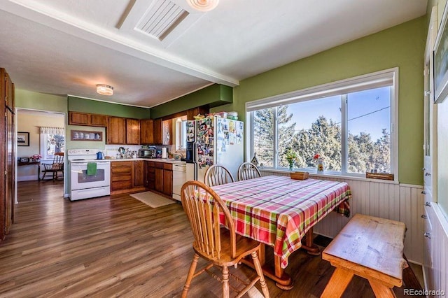 dining area with dark hardwood / wood-style floors