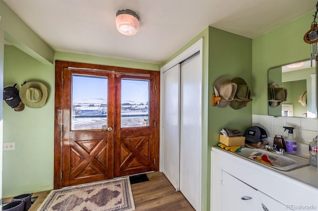 entryway with dark hardwood / wood-style flooring