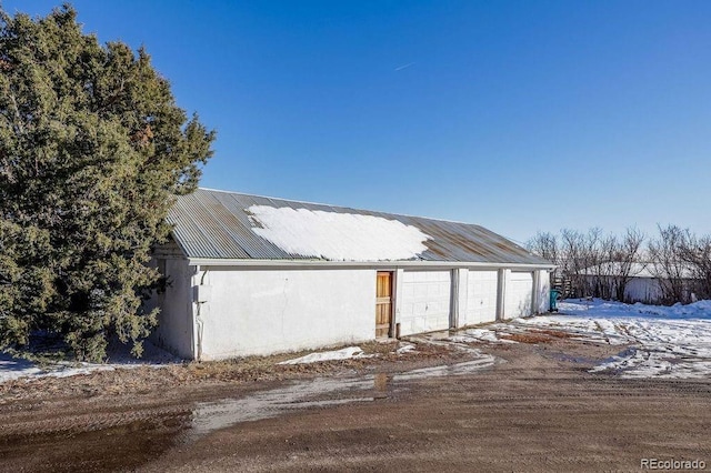 view of snow covered garage