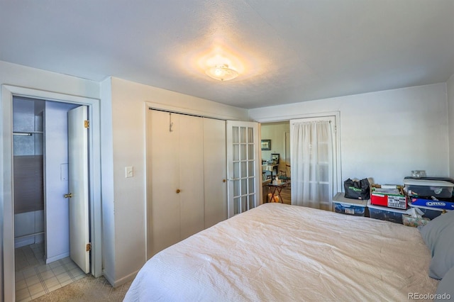 bedroom featuring a closet and french doors