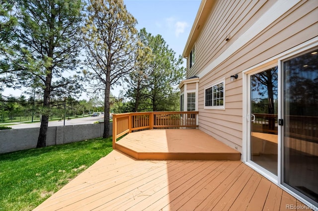 deck featuring a lawn