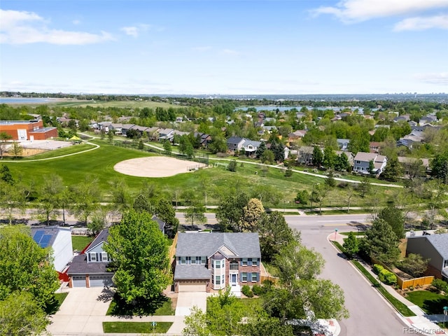 aerial perspective of suburban area featuring a nearby body of water