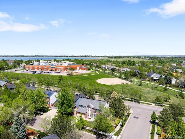 aerial view of residential area featuring a nearby body of water
