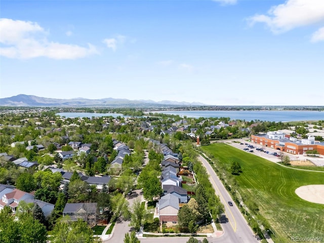 aerial perspective of suburban area with a water and mountain view
