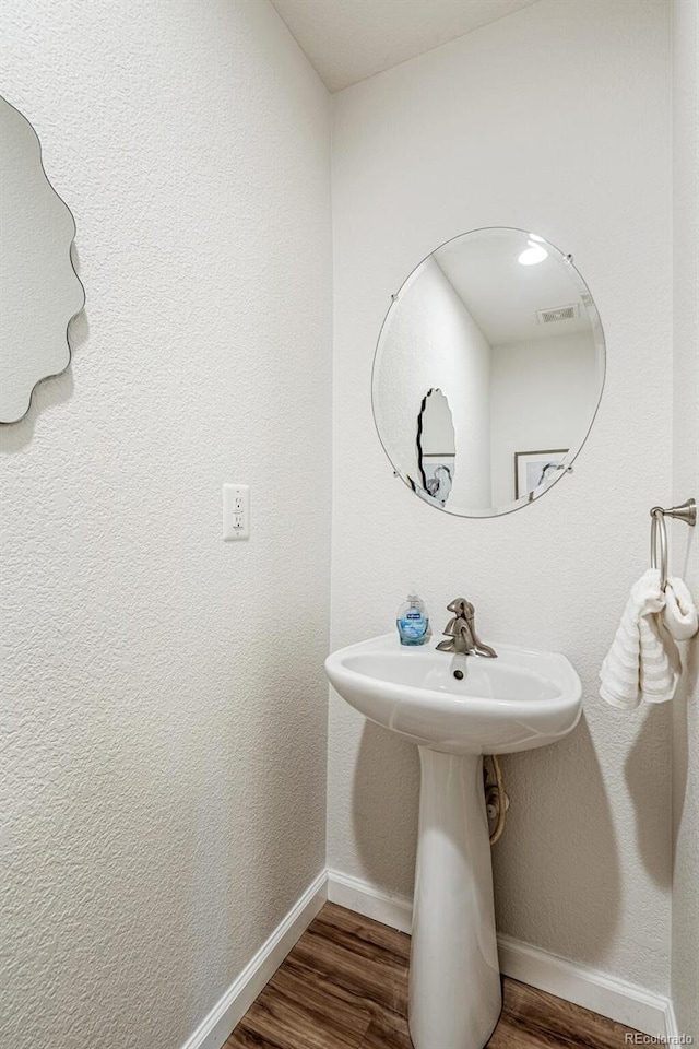 bathroom featuring wood-type flooring