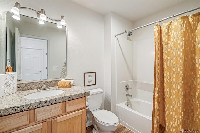 full bathroom featuring vanity, shower / tub combo with curtain, and toilet