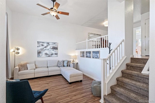 living room featuring hardwood / wood-style flooring and ceiling fan