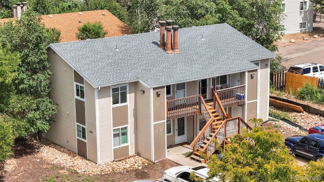 exterior space featuring stairway and fence