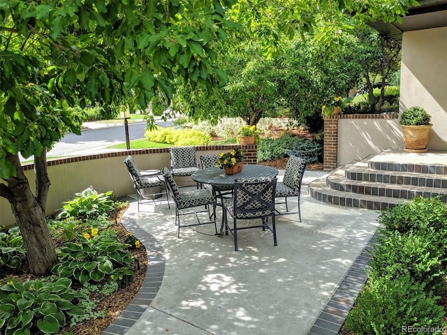 view of patio featuring outdoor dining area