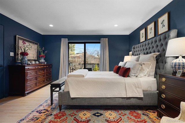 bedroom with wood finished floors and recessed lighting