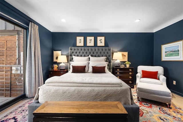 bedroom featuring recessed lighting and wood finished floors