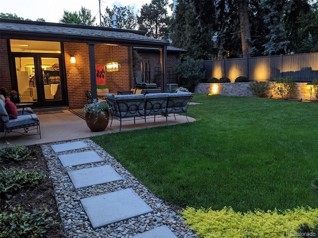 view of yard with a patio area, fence, and an outdoor living space