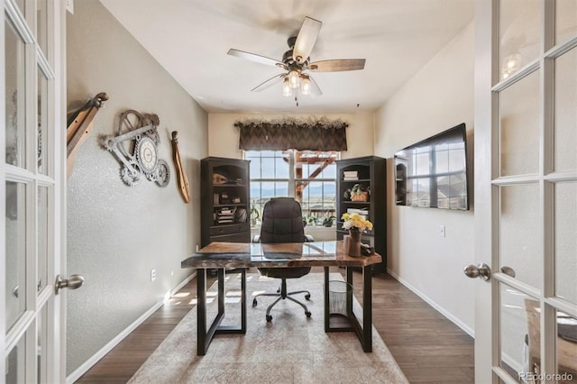 office with baseboards, french doors, and wood finished floors