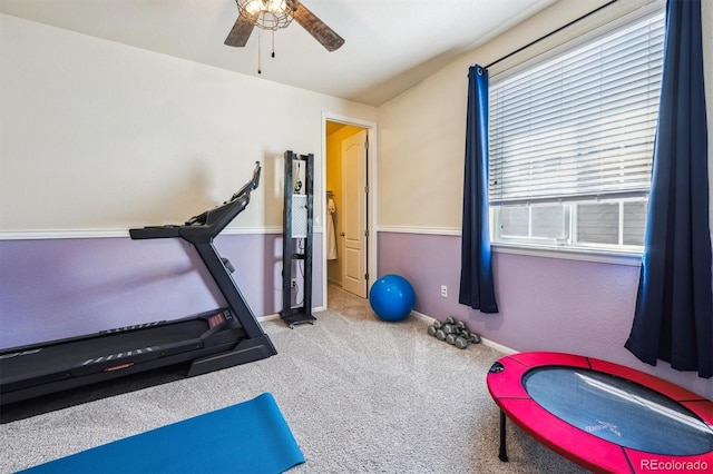 workout room featuring carpet flooring, baseboards, and a ceiling fan