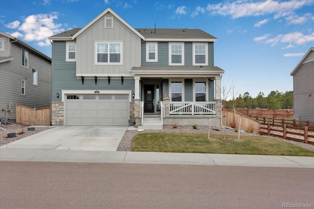 view of front of house with a porch and a garage