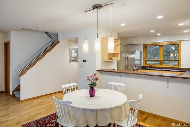 dining room featuring light wood-type flooring