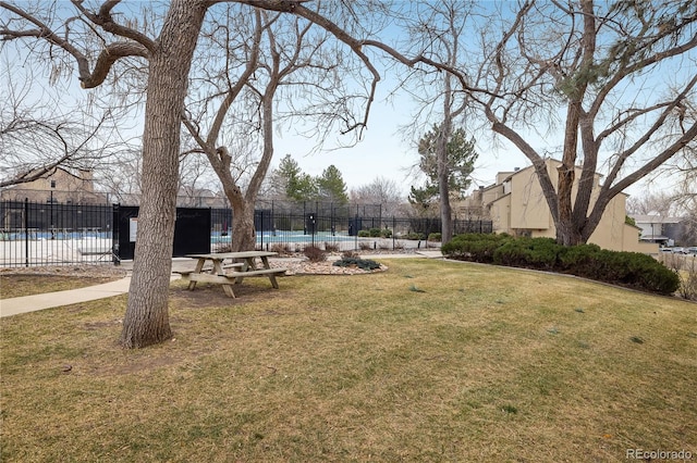 view of yard featuring a community pool