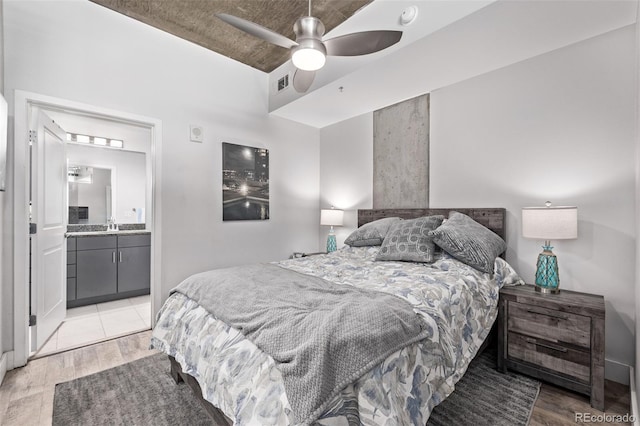1700 Bassett St Unit 820, Denver, CO 80202 - bedroom featuring light wood-style floors, ensuite bath, ceiling fan, and a sink