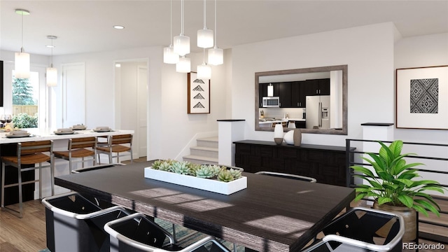 dining space featuring stairs, a chandelier, wood finished floors, and recessed lighting