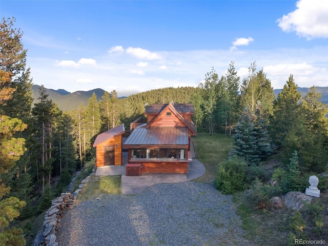 1000 Rangeview Ct, Black Hawk, CO 80422 - view of front of property with a wooded view, a mountain view, and a metal roof