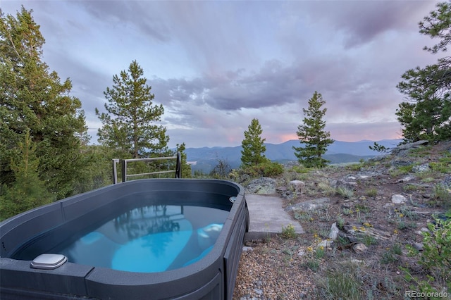 1000 Rangeview Ct, Black Hawk, CO 80422 - view of pool featuring a mountain view and a hot tub