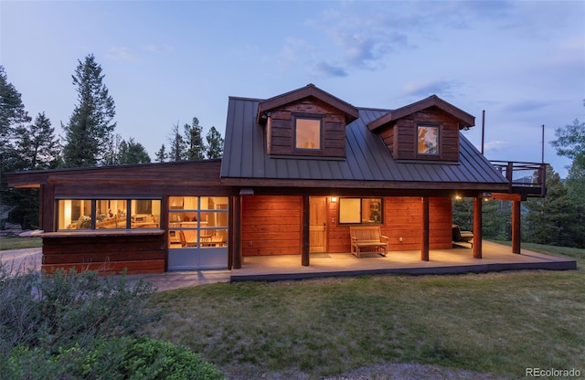 1000 Rangeview Ct, Black Hawk, CO 80422 - rear view of property with a lawn, a metal roof, and a standing seam roof