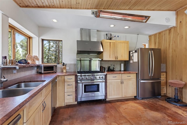 1000 Rangeview Ct, Black Hawk, CO 80422 - kitchen with appliances with stainless steel finishes, wall chimney range hood, finished concrete floors, light brown cabinets, and backsplash