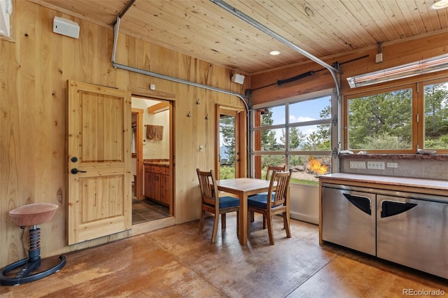 1000 Rangeview Ct, Black Hawk, CO 80422 - dining space with wooden walls, concrete floors, and wood ceiling