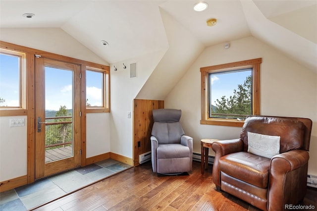 1000 Rangeview Ct, Black Hawk, CO 80422 - sitting room featuring vaulted ceiling, a baseboard radiator, and light wood finished floors