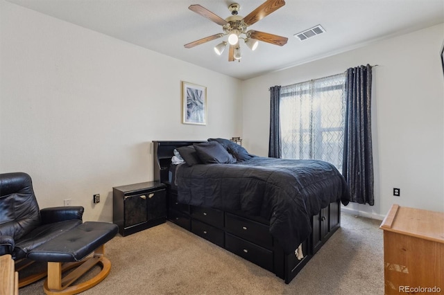 bedroom with light carpet, baseboards, visible vents, and ceiling fan