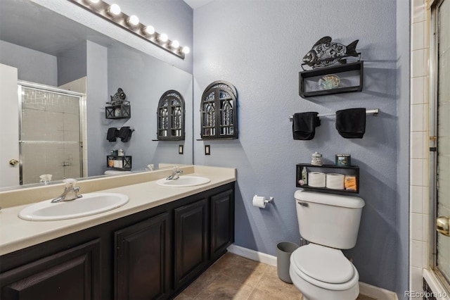 full bath featuring toilet, a sink, and tiled shower