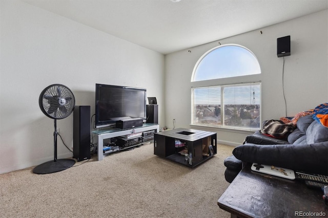 carpeted living room featuring baseboards