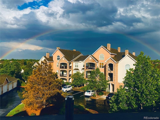 18989 E Warren Dr Unit G303, Aurora, CO 80013 - view of building exterior featuring uncovered parking