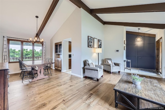 10397 Yates Ct, Westminster, CO 80031 - living area featuring a chandelier, beam ceiling, light wood finished floors, baseboards, and high vaulted ceiling