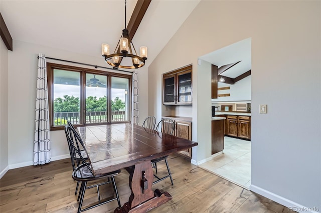 10397 Yates Ct, Westminster, CO 80031 - dining room with a chandelier, beam ceiling, baseboards, light wood-type flooring, and high vaulted ceiling